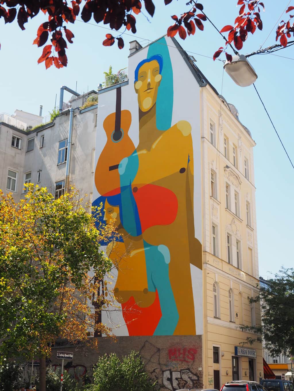 "Musician with Guitar Portrait" by Zësar Bahamonte in Vienna