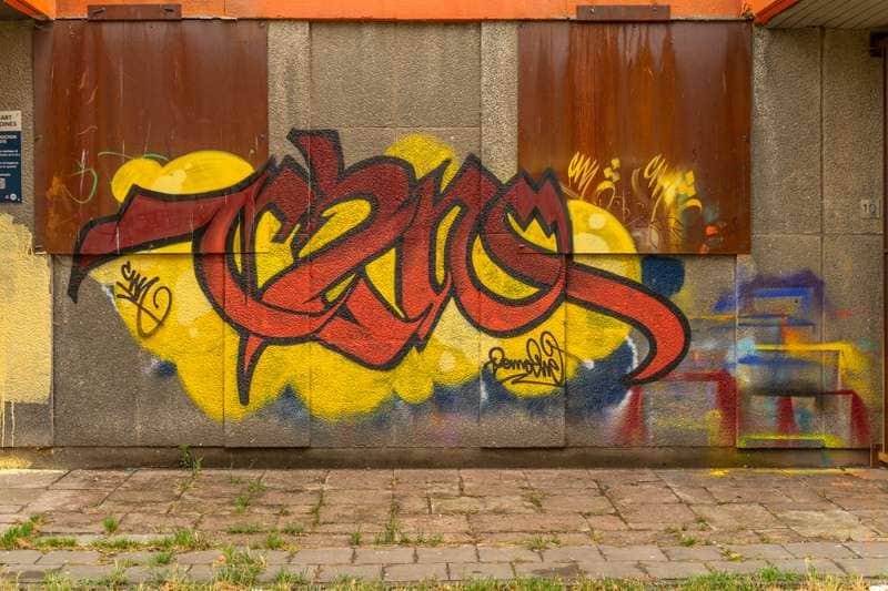 "Bold Red and Yellow Graffiti" by Dema in Brussels