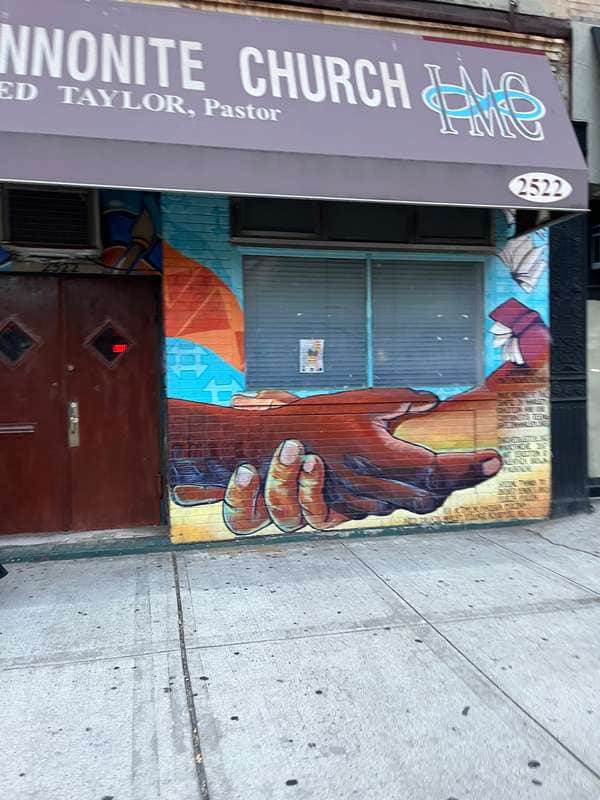"Praying Hands Mural" by Aleathia Brown in New York