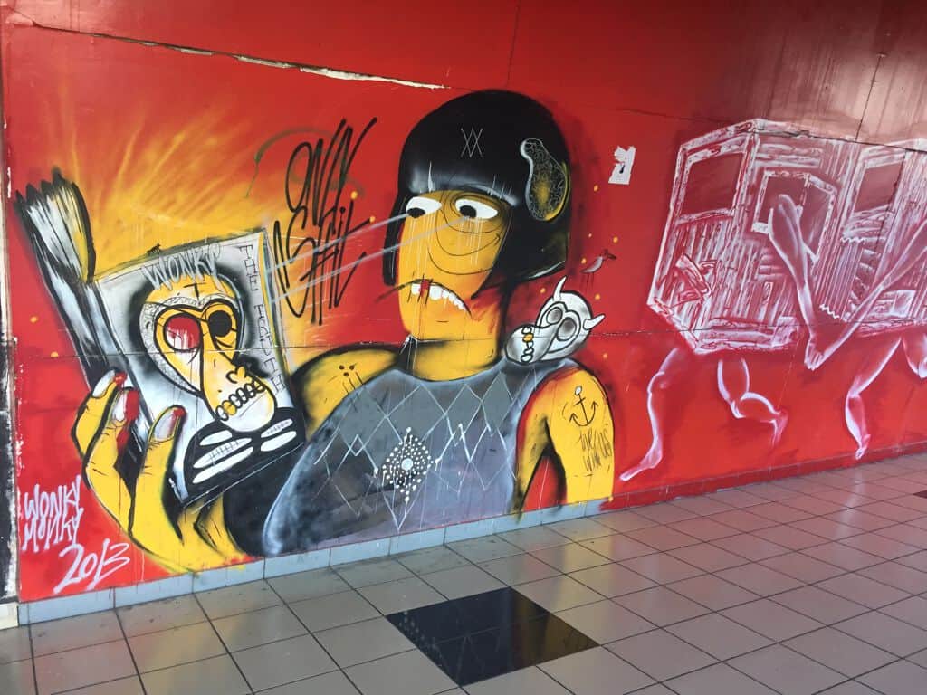 "Yellow Figure with Weapon and Skull" by Wonky Monky in Telaviv