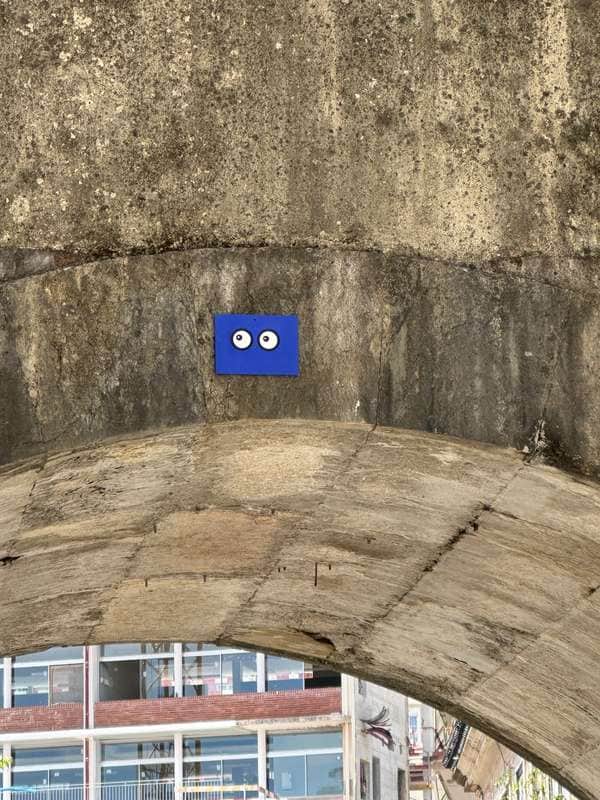 "Watchful Eyes Under Bridge" in Lisbon