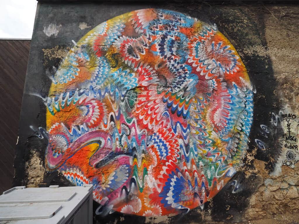 "Colorful Patterned Skull Head" by Hoxxoh in Vienna