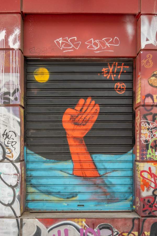 "Raised Fist Rising from Water" by exit in Athens